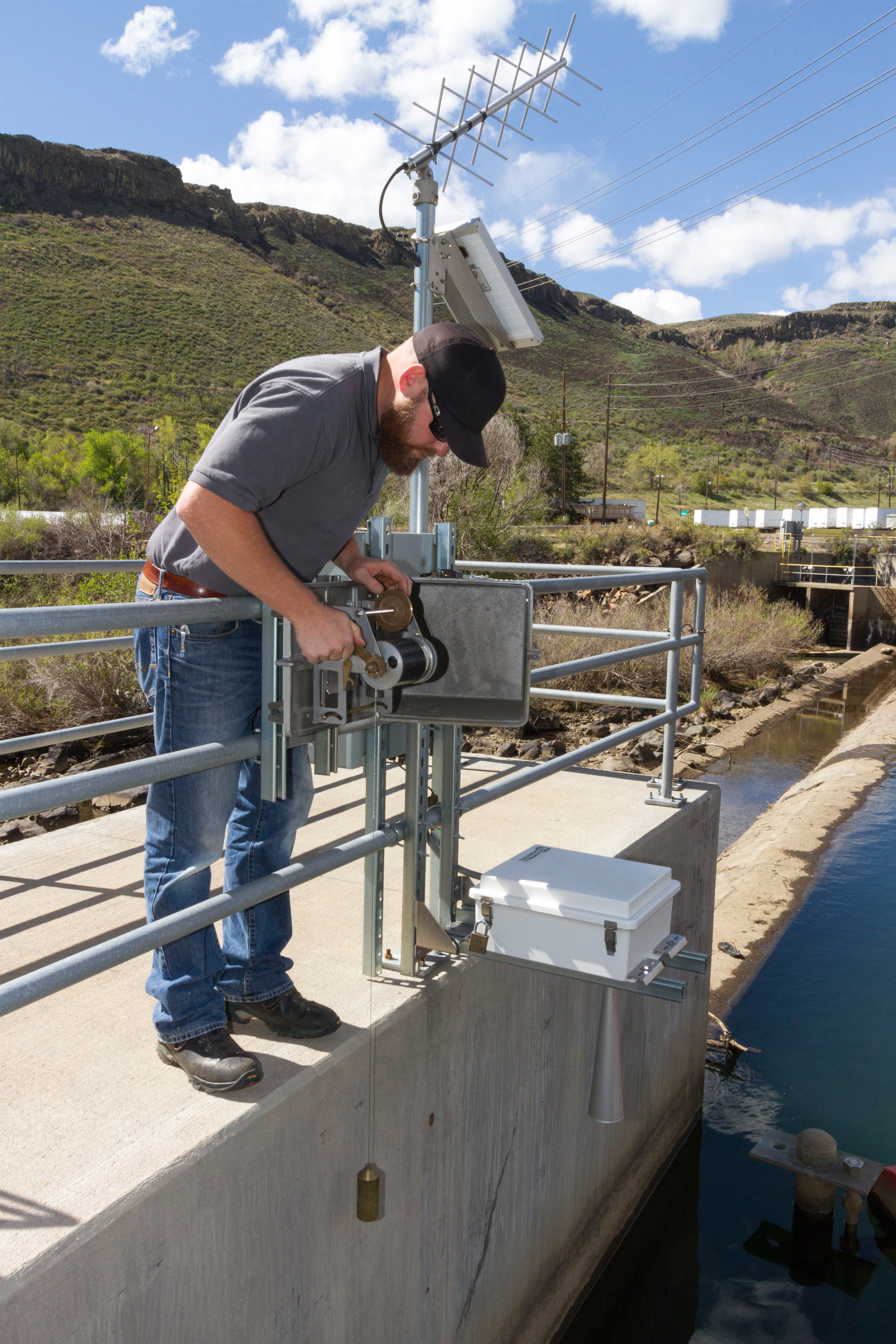 Jason Smith checks a stream gauge on Clear Creek